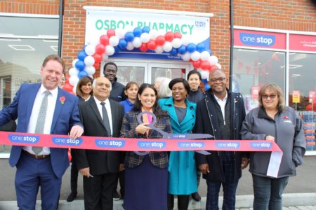 Priti Patel with staff from Osbon Chemists and the One Stop shop, officiating at the ribbon cutting ceremony