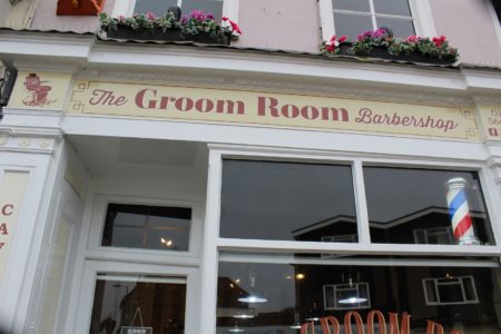 Views of The Groom Room Barbershop signage