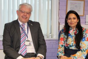 Priti Patel MP with Headteacher David Bome, during her visit to Copford Church of England Primary School.