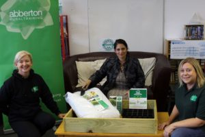 Jacqui Stone (left) and Wendy Bixby (right) of Abberton Rural Training showing Priti Patel the grow your own food starter pack.
