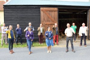 Priti Patel MP with Essex farmers giving a thumbs up to Back British Farming Day.