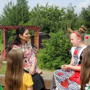Priti Patel chats with pupils about Get Witham Reading at Powers Hall Academy.