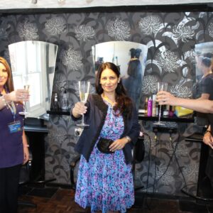 Priti Patel MP toasts 17 years in business with Finishing Touches proprietors, Zoe Chivers (left) and Hayley Jackson (right)