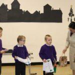 All three of the competition winners receiving their special goodie bags from Priti Patel MP, at the special assembly.