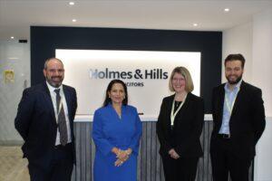 Priti Patel MP with Holmes & Hills Partner Steven Hopkins, Sue Hume, Finance Manager and Philip Davies, Head of Business Development.