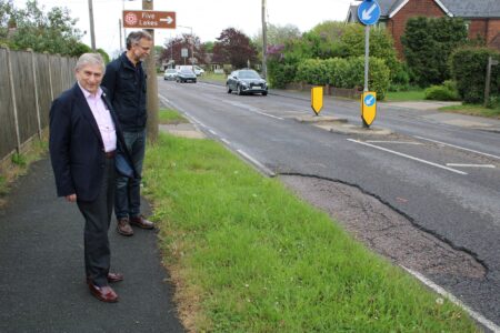 Cllr Lee Scott with Tiptree Parish Council Chairman, Jonathan Greenwood inspecting one of Tiptree’s most notorious pot holes.