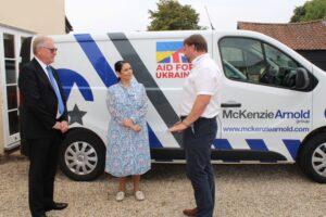 Priti with Mike Jackson, Managing Director of McKenzie Arnold Group (left) and Martin Jackson, Head of Operations with one of the Group’s security vehicles at their Faulkbourne HQ.