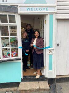 Priti with Hannah Thompson and Paul Hayward, MDs of Woof & Purr, cutting the ribbon to open Woof & Purr, Coggeshall