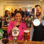 Priti pulls a pint behind the bar of the Green Man, Little Braxted alongside the pub’s owner Ylli Vata.