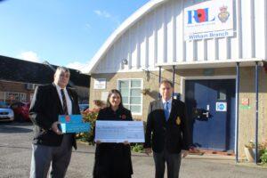 Priti Patel MP presents her donation to Bob Barker (left) Vice-Chairman of the Royal British Legion, Witham and Frank Zada, Poppy Appeal Organiser, outside the Memorial Hall, Witham.