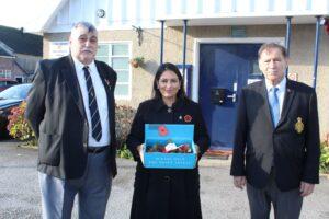 Priti Patel MP with a Poppy Appeal collector’s tray, alongside Bob Barker (left) Vice-Chairman of the Royal British Legion, Witham and Frank Zada, Poppy Appeal Organiser.