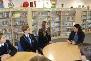 Priti takes questions from a group of New Rickstones Academy students, in the school library.