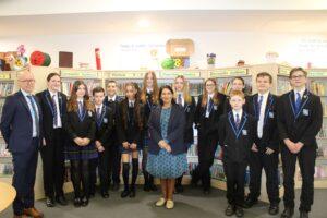 Priti Patel MP with the students who took part in the Q & A session and Head of School, Simon Gibbs.