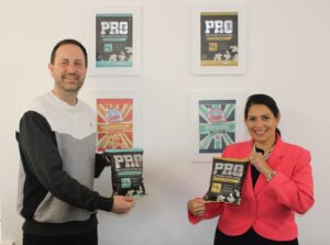 Priti Patel MP with Retrocorn Ltd’s Managing Director, Greg Taylor and packets of their world first sugar free protein popcorn.