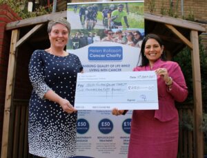 Priti Patel MP presents Helen Rollason Cancer Charity CEO, Kate Alden with a cheque for £250.00
