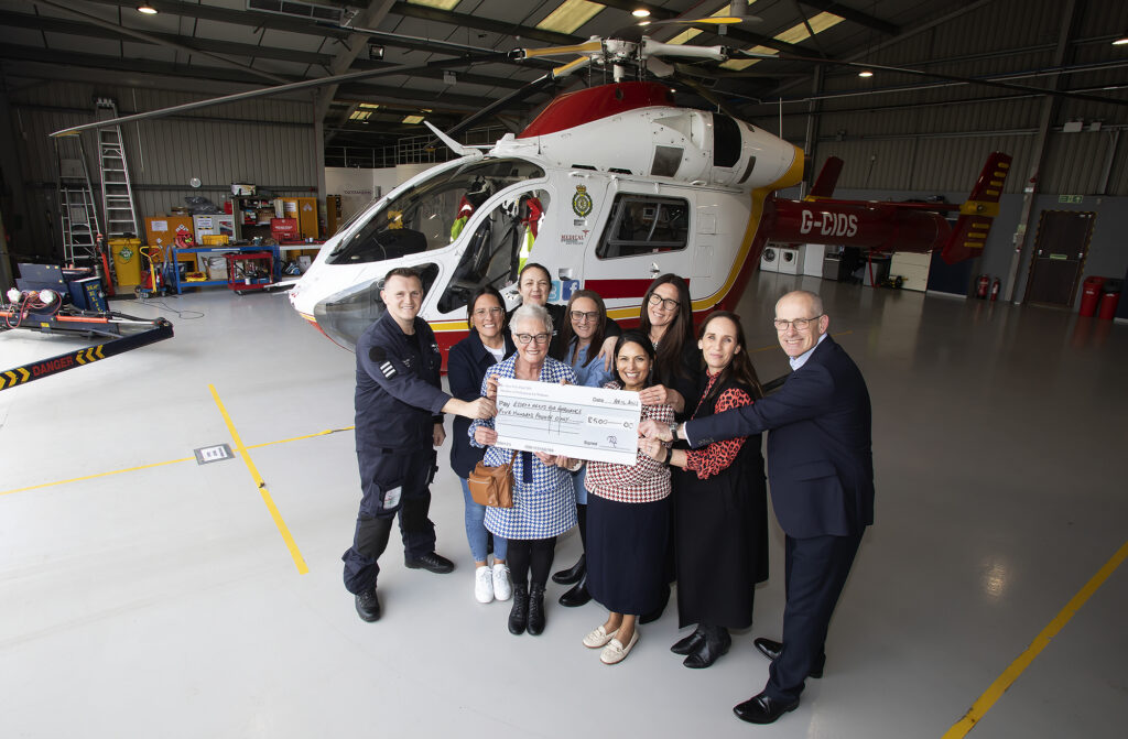 Priti visits the Essex & Herts Air Ambulance Trust Airbase at Earls Colne to pay tribute to Witham constituent Dennis Miller