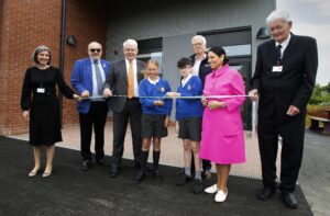 Priti Patel MP at the opening of the new building at Copford Primary School with, from left, Katie Hanson Chair of Governors, Cllr Tony Ball Essex County Council Cabinet Member for Education, David Bome Headteacher, Mervyn Denney MD of TJ Evans, and David De’Ath Vice Chair of Governors. The two students are representing the Year 6 School Council
