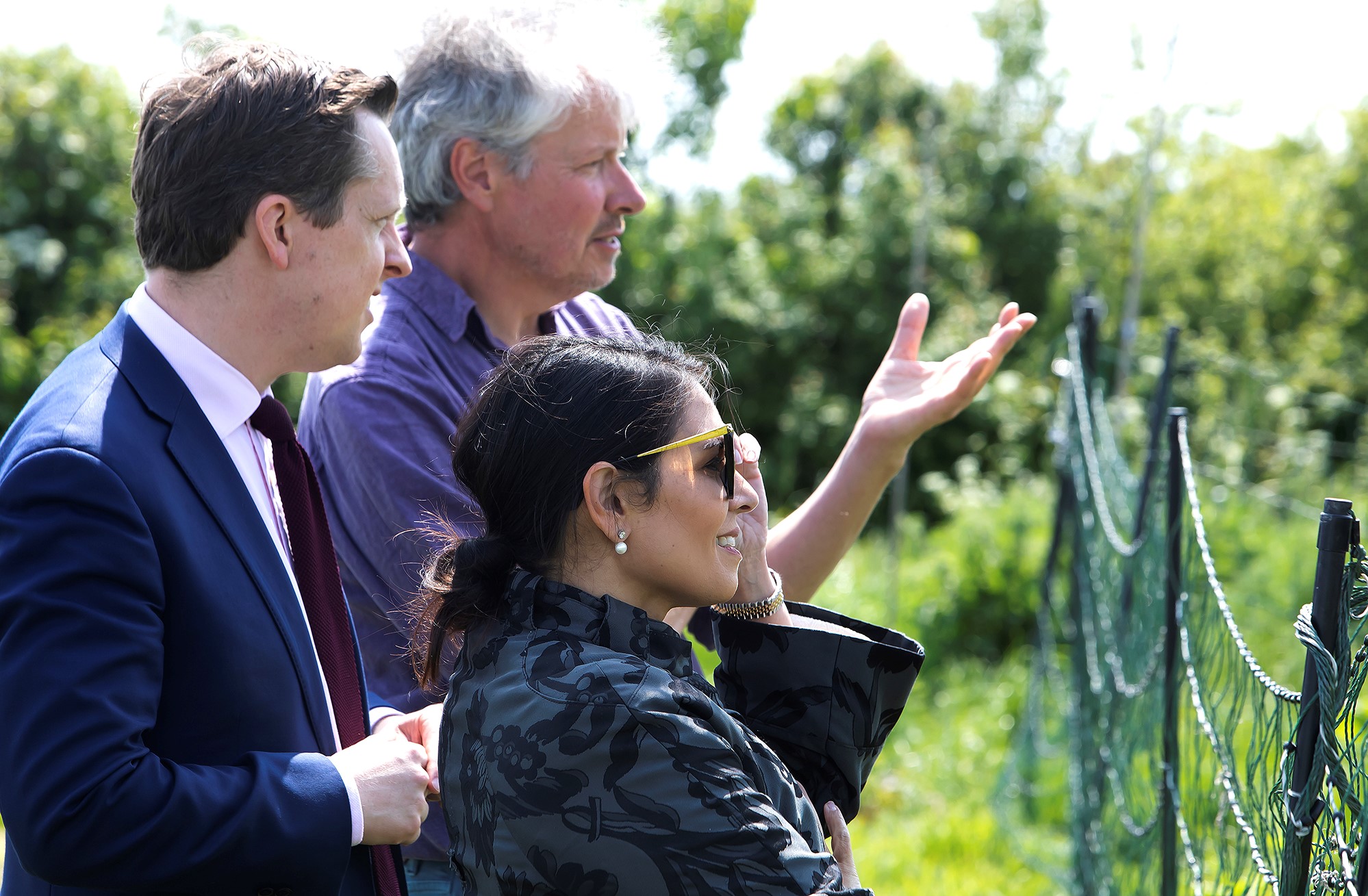 Spencer Christy, Director at Lauriston Farm, talks with the Minister and Priti during their visit