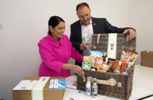 Priti Patel MP with Secret Hamper Managing Director, Nigel Richardson, examining the contents of one of the company’s specialist hampers