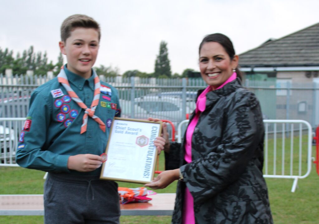 Priti presents the Chief Scout’s Gold Award to a Silver End Scout