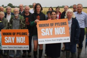 Priti Patel MP with Rosie Pearson (holding board) and campaigners against the pylons