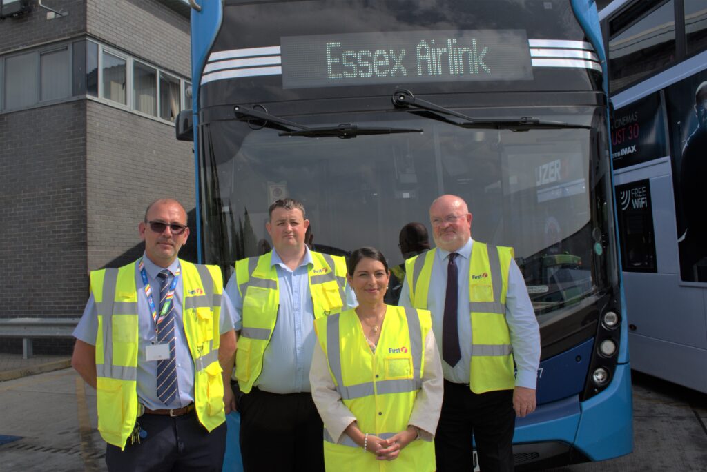 Priti with MD Piers Marlow and other staff during the tour of the First Bus depot