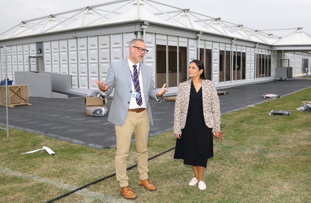 Priti speaking with Honywood headteacher James Saunders whilst touring the temporary classrooms that have been erected