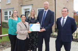 Priti presents fundraising award for Great Ormand Street Hospital to Louise Hewitt and Sarah Tew along with senior representatives from David Wilson Homes.