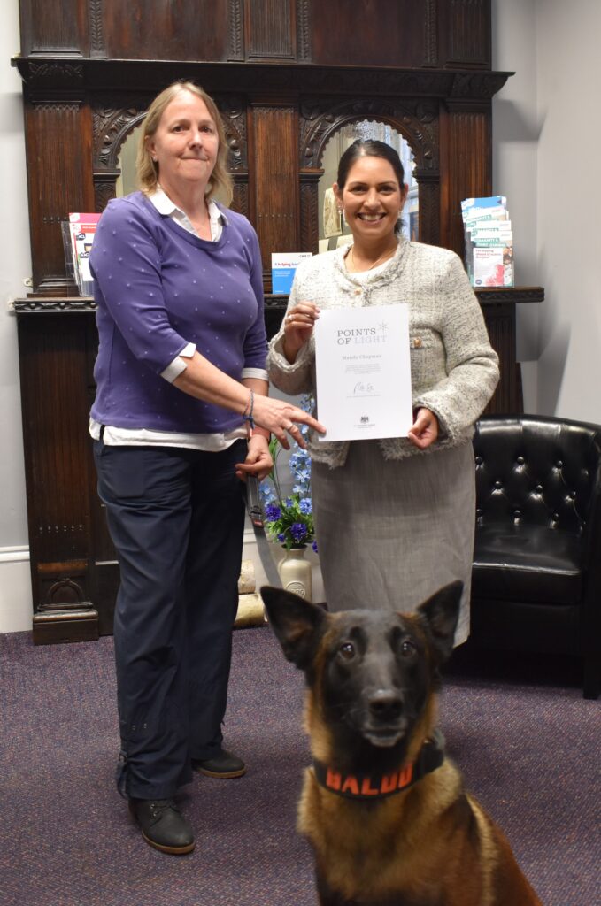 Priti meets with Points of Light winner and hero service dog